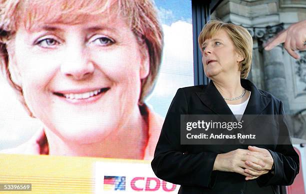 Candidate Chancellor, Angela Merkel, of the German Christian Democrats , looks on at the Square in front of the chateau August 16, 2005 in Dresden,...