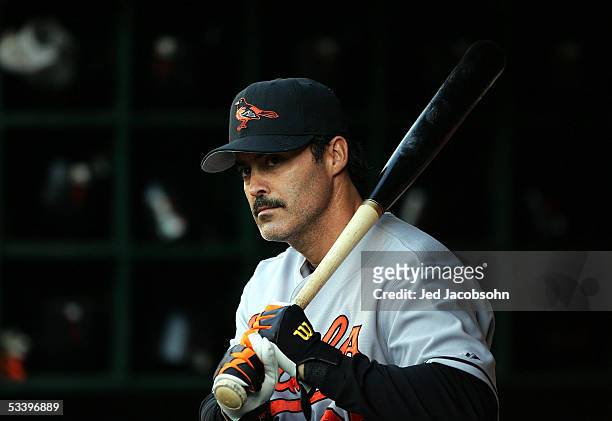 Rafael Palmeiro of the Baltimore Orioles looks on from the dugout during an MLB game against the Oakland Athletics at McAfee Coliseum on August 16,...