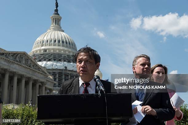 Nguyen Dinh Thang, executive director of Boat People SOS, speaks at a press conference with US Republican Representative from Virginia Barbara...