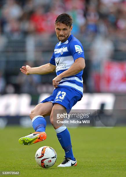 James Holland of Duisburg kicks the ball during the Second Bundesliga Play Off first leg match between Wuerzburger Kickers and MSV Duisburg at...