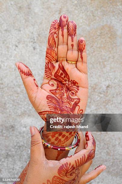 mehandi or henna design - henna hands stock-fotos und bilder