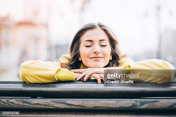 daydreaming and enjoying the sunlight - day dreaming stock pictures, royalty-free photos & images