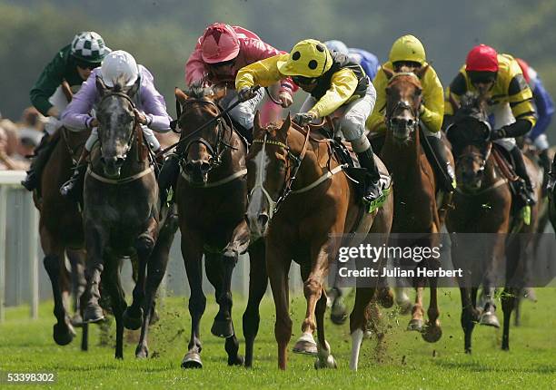 Alan Munro and Sergeant Cecil start there run for home to land The Tote Ebor Race run at York Racecourse on August 17, 2005 in York, England.