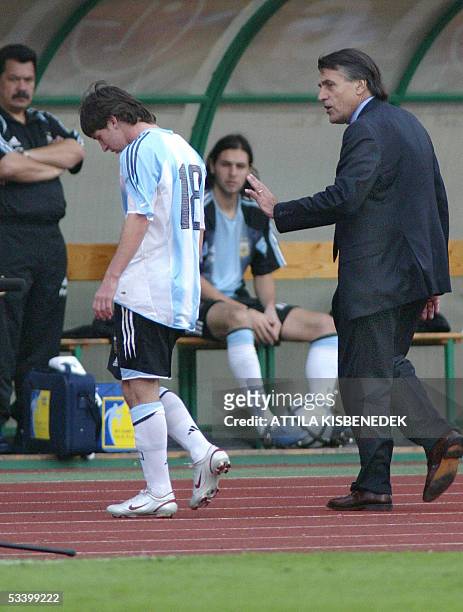 Argentine's Lionel Messi is comforted by his coach Jose Pekerman after receiving a red card at the Puskas stadium in Budapest, 17 August 2005 during...