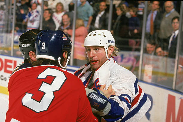 marty-mcsorley-of-the-new-york-rangers-fights-paul-laus-of-the-florida-panthers-as-an-official.jpg