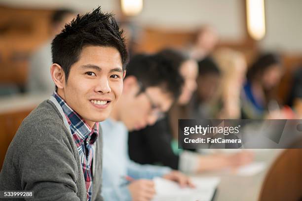 young man taking a college course - east asian ethnicity stock pictures, royalty-free photos & images