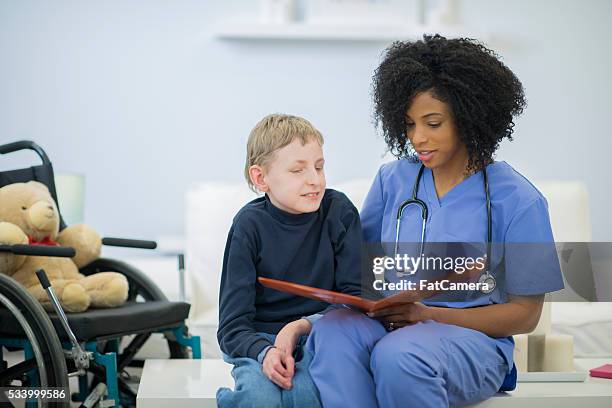 Patient Reading Reference 2,493 Nurse Reading To Patient Stock Photos, High-Res Pictures, and ...