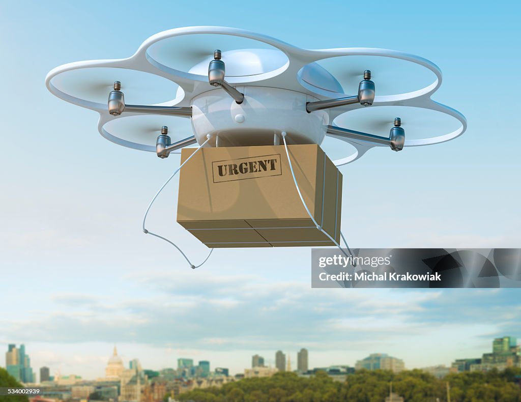 Delivery drone carrying urgent shipment box in a city.