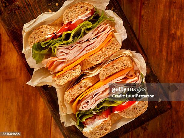 deli style turkey bagel sandwich - cheddar cheese above stock pictures, royalty-free photos & images