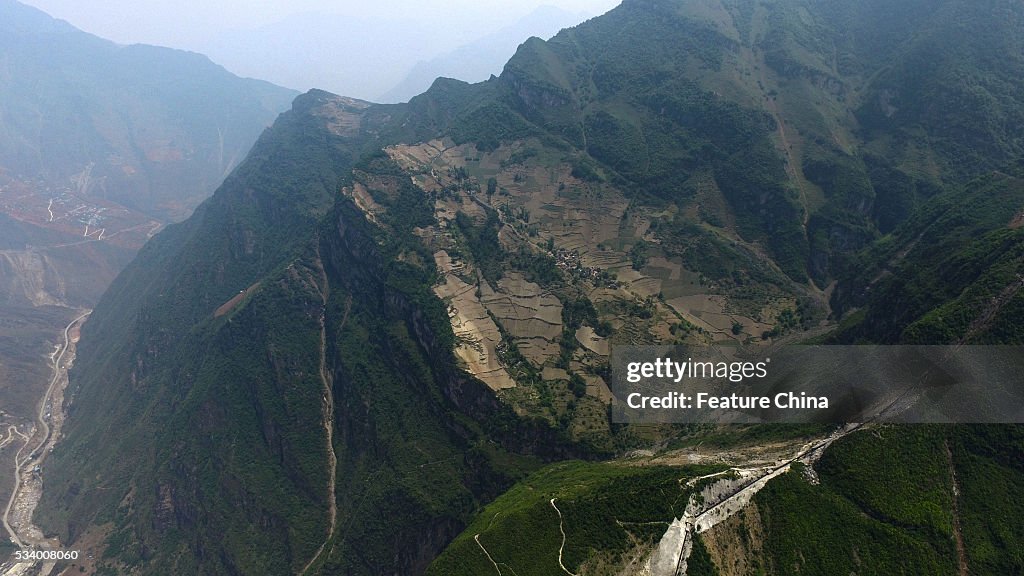 Children From Remote Chinese Village Climb Unsecured Vine Ladders On A Vertical Cliff