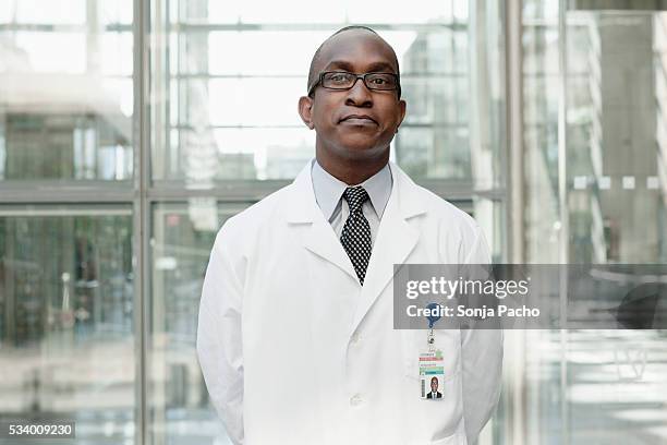 portrait of doctor - clean suit stock pictures, royalty-free photos & images