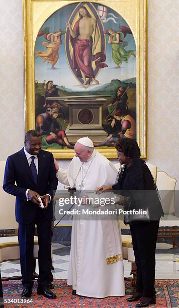 Pope Francis in a private audience with the President of Togo Faure Gnassingbé and his wife Nana Ama Kufuor in the Private Library of the Apostolic...