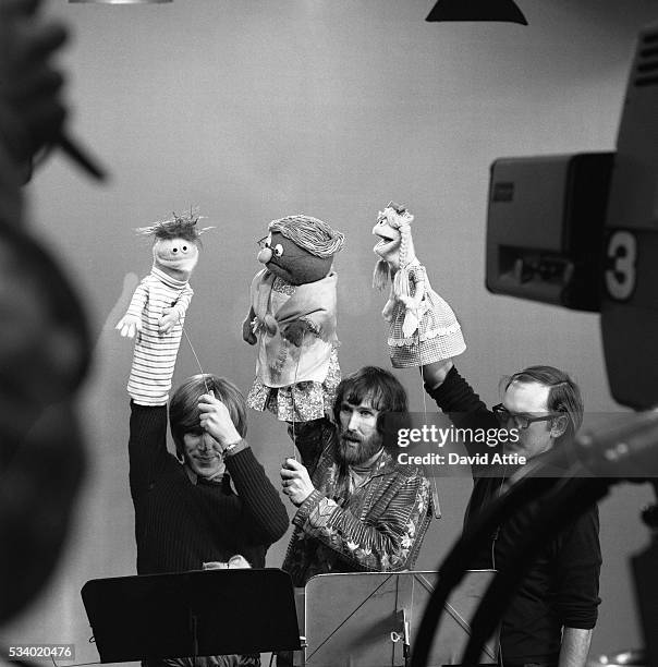 Puppeteers (L-R: Daniel Seagren holding Roosevelt Franklin, Jim Henson holding Grandmother Happy and Frank Oz with Betty Lou rehearse for an episode...