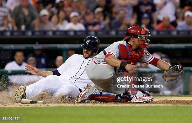 Martinez of the Detroit Tigers scores from second base on a single by Victor Martinez of the Detroit Tigers, beating a tag from catcher Carlos Ruiz...