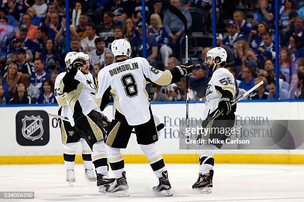Kris Letang of the Pittsburgh Penguins celebrates with his teammates after scoring a goal against Andrei Vasilevskiy of the Tampa Bay Lightning...