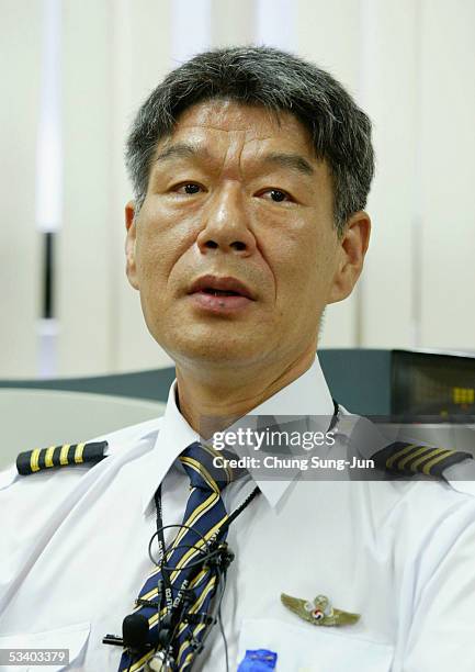 Union leader of Korean Air Shin Man-Soo speaks at the press conference on August 18, 2005 in Seoul, South Korea. South Korea's largest airline, said...