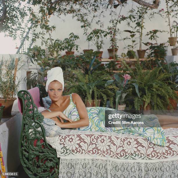 Brigitte Lapp Fonda reclines amidst the foliage in Marbella, circa 1980.