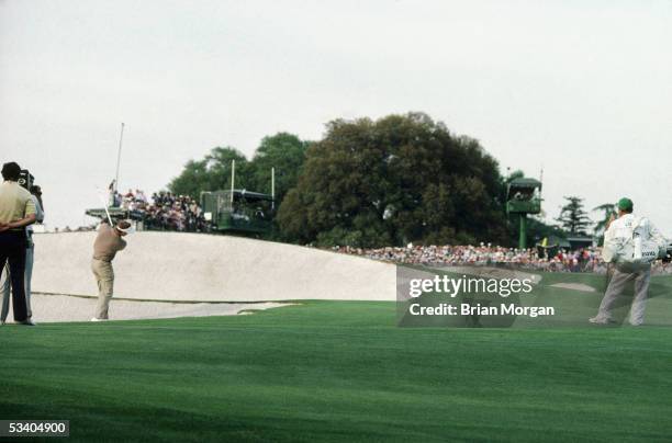 Sandy Lyle of Scotland hits a bunker shot on the 18th hole during the final round of the Masters on April 10th 1988 at The Augusta National Golf...