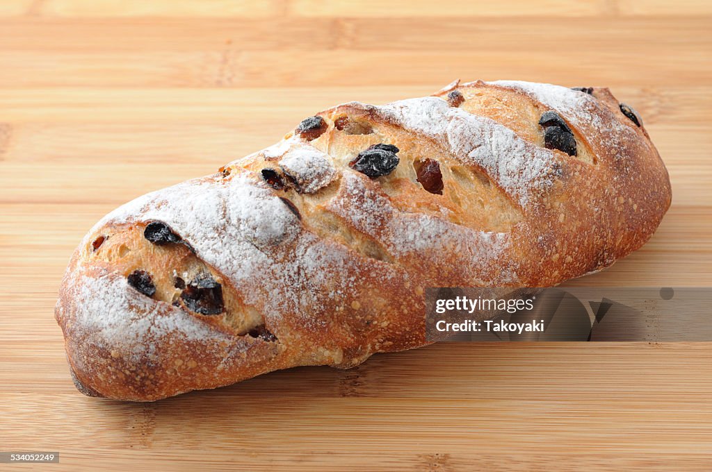 French Baguette Bread with raisin isolated on cutting board