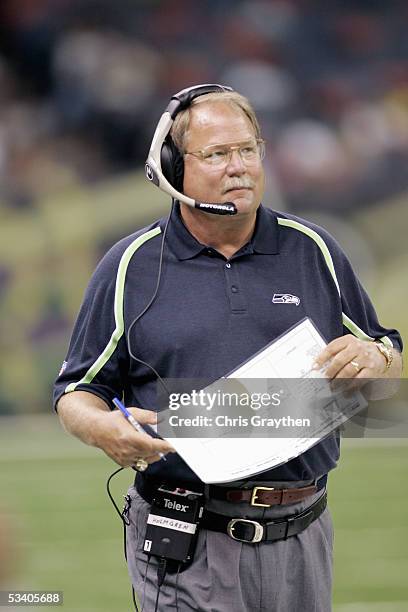 Head coach Mike Holmgren of the Seattle Seahawks walks the sideline during the preseason game against the New Orleans Saints on August 12, 2005 at...