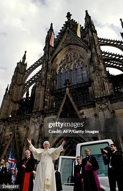 Pope Benedict XVI addresses pilgrims outside Cologne's Cathedral, Germany, next to the city's Archbishop Joachim Meisner , 18 August 2005, on the...