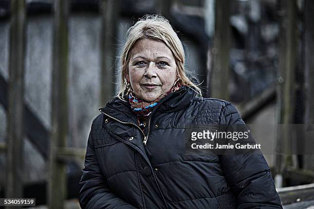 portrait of a middle aged women in front of ruin - mature women serious stock pictures, royalty-free photos & images