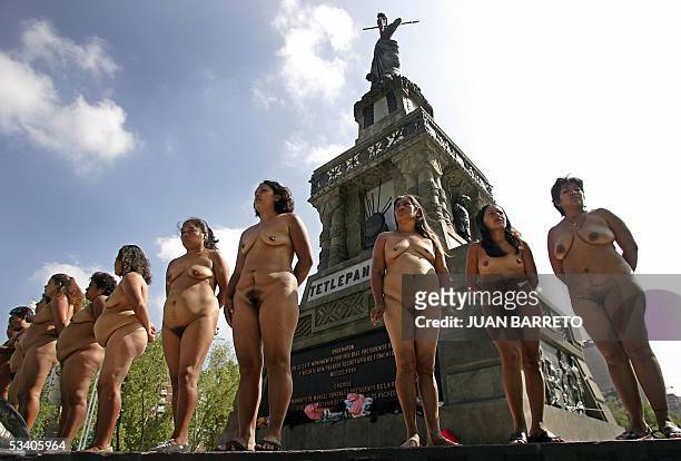 Peasant women members of the group "Los 400 Pueblos ", demonstrate in the nude in Mexico City, 18 August 2005, demanding the land that have been...