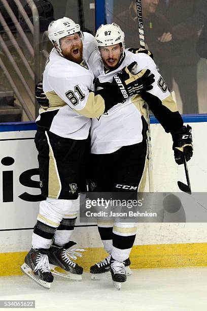 Sidney Crosby of the Pittsburgh Penguins celebrates with his teammate Phil Kessel after scoring a goal against Andrei Vasilevskiy of the Tampa Bay...