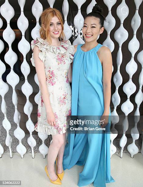 Actresses Katherine McNamara and Arden Cho attend the Wolk Morais Collection 3 Fashion Show on May 24, 2016 in Los Angeles, California.