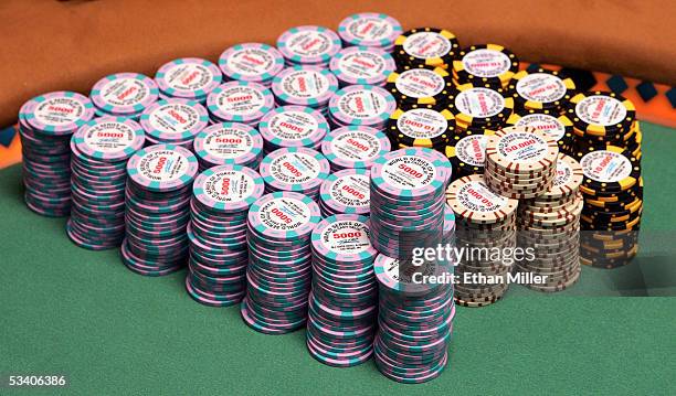 Poker chips are seen stacked on the main table during the sixth round of the World Series of Poker no-limit Texas Hold 'em main event at Binion's...