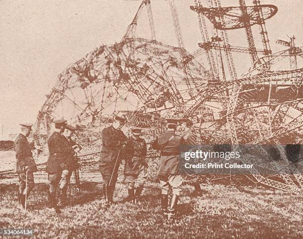 British staff officers examining the wreckage of a Zeppelin brought down in England' , from 'The Wonder Book of Aircraft for Boys and Girls,' edited...