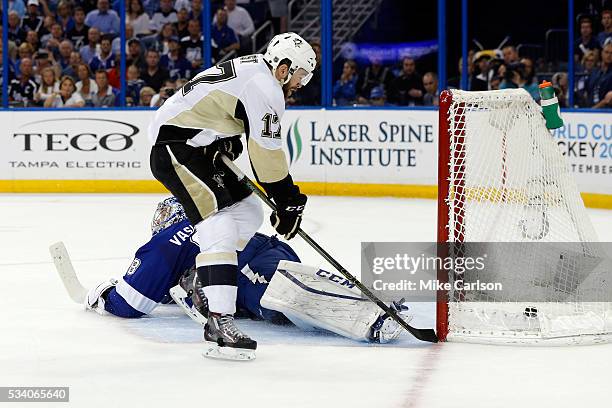 Bryan Rust of the Pittsburgh Penguins scores a goal on Andrei Vasilevskiy of the Tampa Bay Lightning during the third period in Game Six of the...