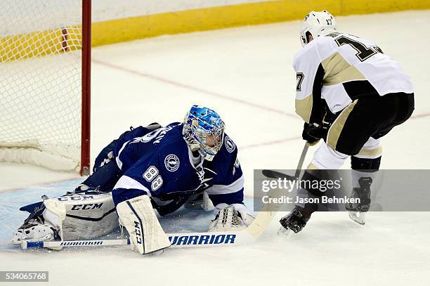 Bryan Rust of the Pittsburgh Penguins scores a goal on Andrei Vasilevskiy of the Tampa Bay Lightning during the third period in Game Six of the...