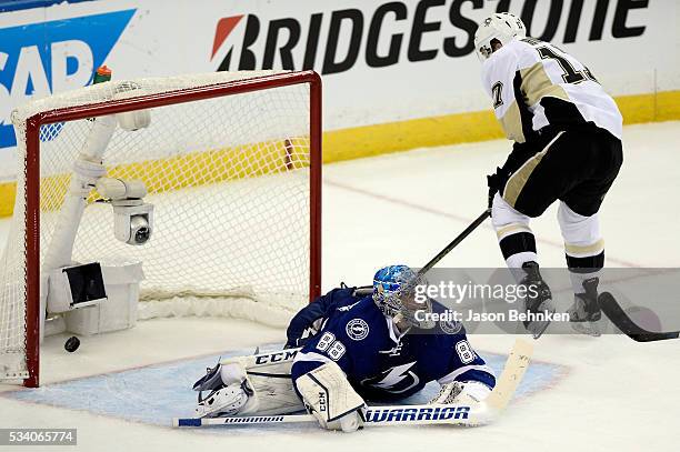 Bryan Rust of the Pittsburgh Penguins scores a goal on Andrei Vasilevskiy of the Tampa Bay Lightning during the third period in Game Six of the...