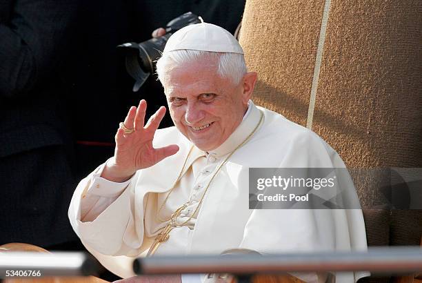 German-born Pope Benedict XVI gestures to pilgrims in front of Cologne Cathedral on August 18, 2005 in Cologne, Germany. The Pope is paying a...