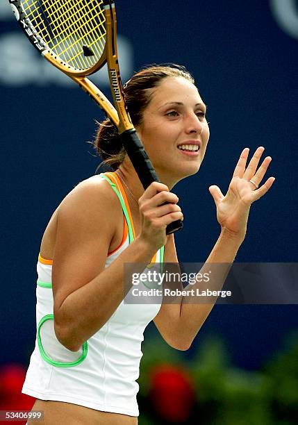 Anastasia Myskina of Russia looks at her coach after defeating Shinobu Asagoe of Japan 7-6 , 7-5 in the third round of the Sony Ericsson WTA Tour...