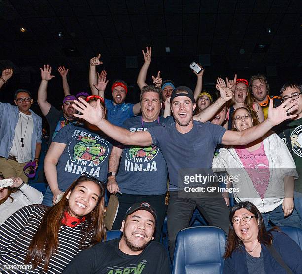 Actor Stephen Amell poses with fans at a special screening of "Teenage Mutant Ninja Turtles: Out Of The Shadows" at Scotiabank Theatre on May 24,...