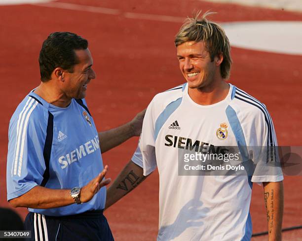 Real Madrid coach Wanderley Luxemburgo chats with David Beckham at a team training session at Las Rozas on August 18, 2005 in Madrid Spain.