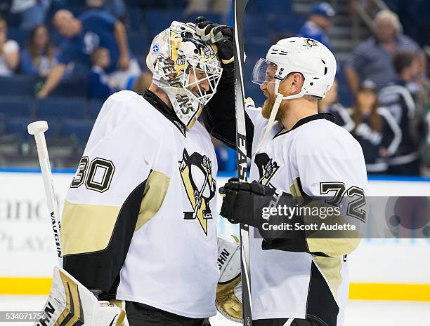Goalie Matt Murray and Patric Hornqvist of the Pittsburgh Penguins celebrate the win against the Tampa Bay Lightning after Game Six of the Eastern...