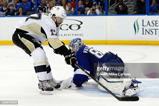 Bryan Rust of the Pittsburgh Penguins scores a goal on Andrei Vasilevskiy of the Tampa Bay Lightning during the third period in Game Six of the...