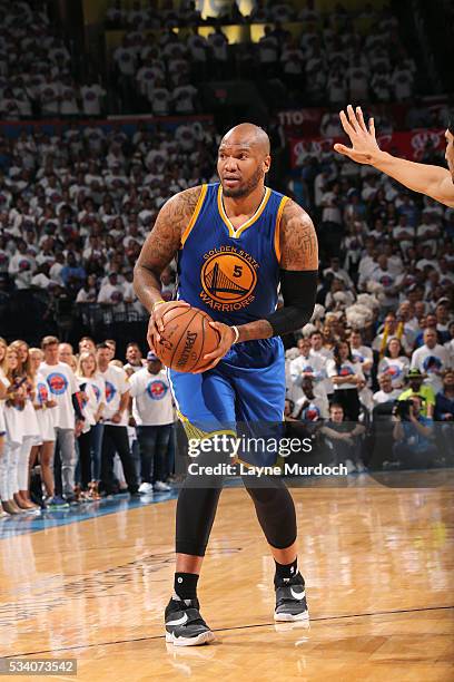 Marreese Speights of the Golden State Warriors handles the ball during the game against the Oklahoma City Thunder in Game Four of the Western...