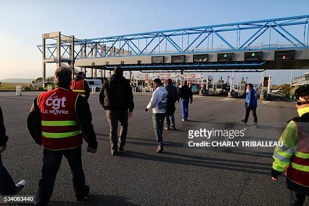 Unionists block the trucks' tollgate of the "Pont de Normandie", in Le Havre northwestern France, on May 25 to protest against the government's...