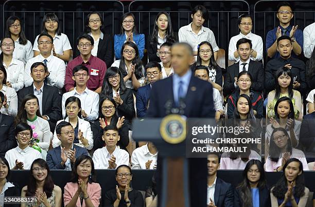 Participants listen as US President Barack Obama speaks at a Young Southeast Asian Leaders Initiative town hall event in Ho Chi Minh City on May 25,...