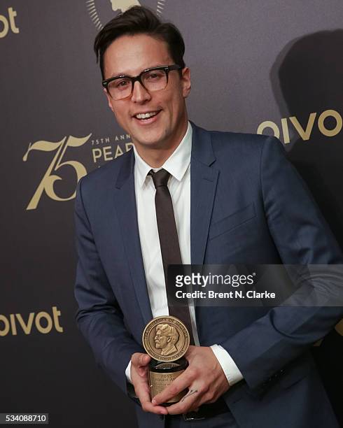 Official recipient for "Beasts of No Nation", director Cary Fukunaga poses for photographs in the press room during the 75th Annual Peabody Awards...