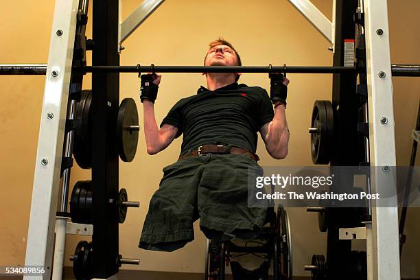 Double Arm transplant recipient, former U.S. Army Sgt. Brendan Marrocco demonstrates pull-ups during occupational therapy at the Amputee Service...