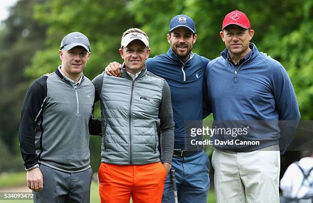 Fomer footballers Paul Scholes, Peter Schmeichel and Jamie Redknapp pose with Luke Donald of England during the Pro-Am prior to the BMW PGA...