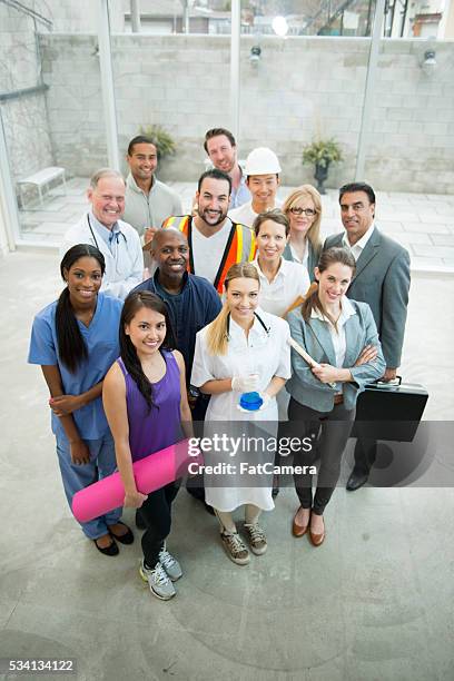 adults workers standing together - different occupation stock pictures, royalty-free photos & images