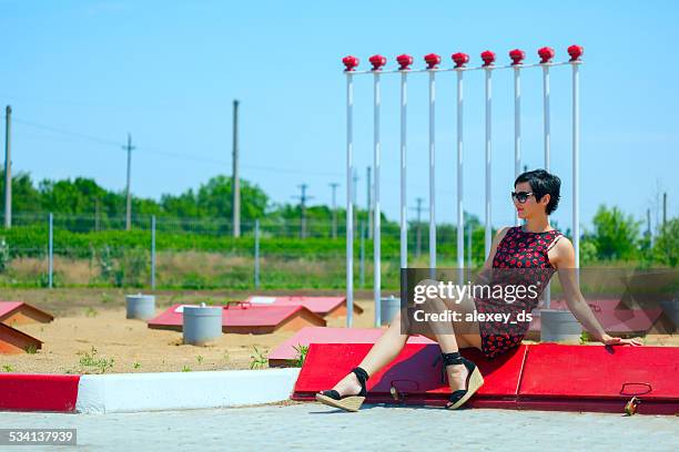 stylish woman at gas station - fire prevention stock pictures, royalty-free photos & images