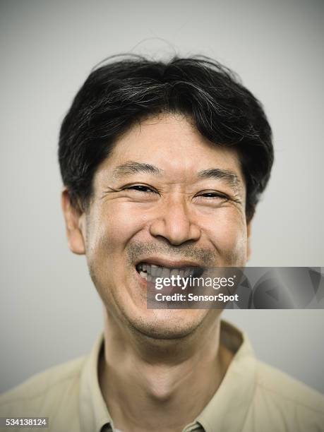 portrait of a japanese man with happy expression. - fine art portrait stockfoto's en -beelden