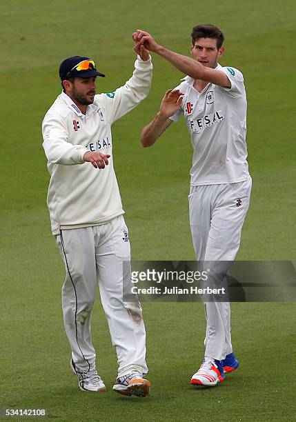 Gloustershire's David Payne and Matt Taylor celerate the wicket of Northamptonshire's Richard Levi during day four of the Specsavers Division Two...